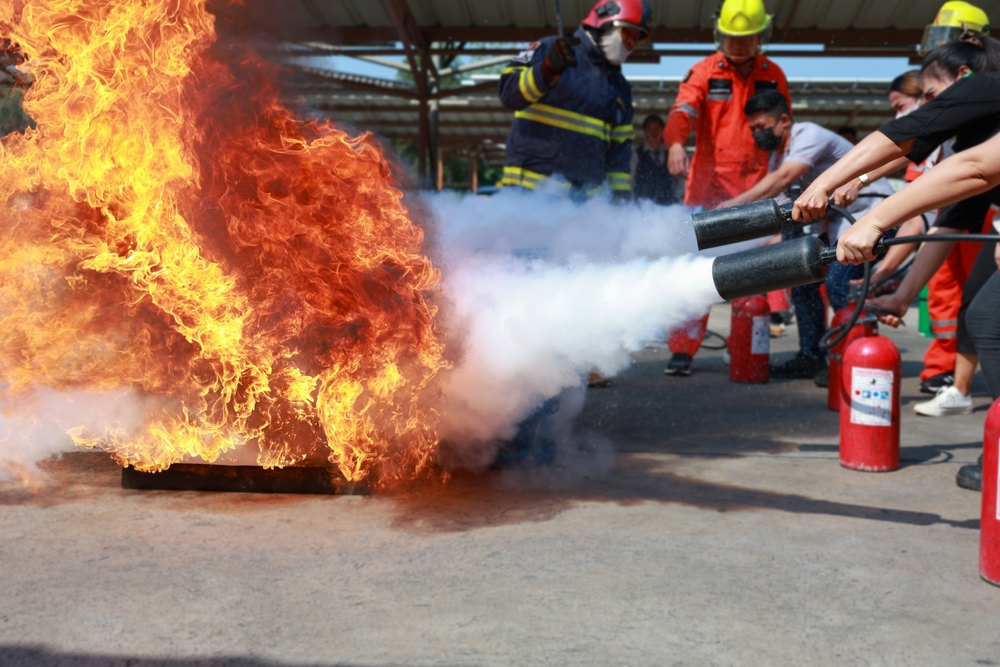 Employees,firefighting,training,,concept,employees,hand,using,fire,extinguisher,fighting
