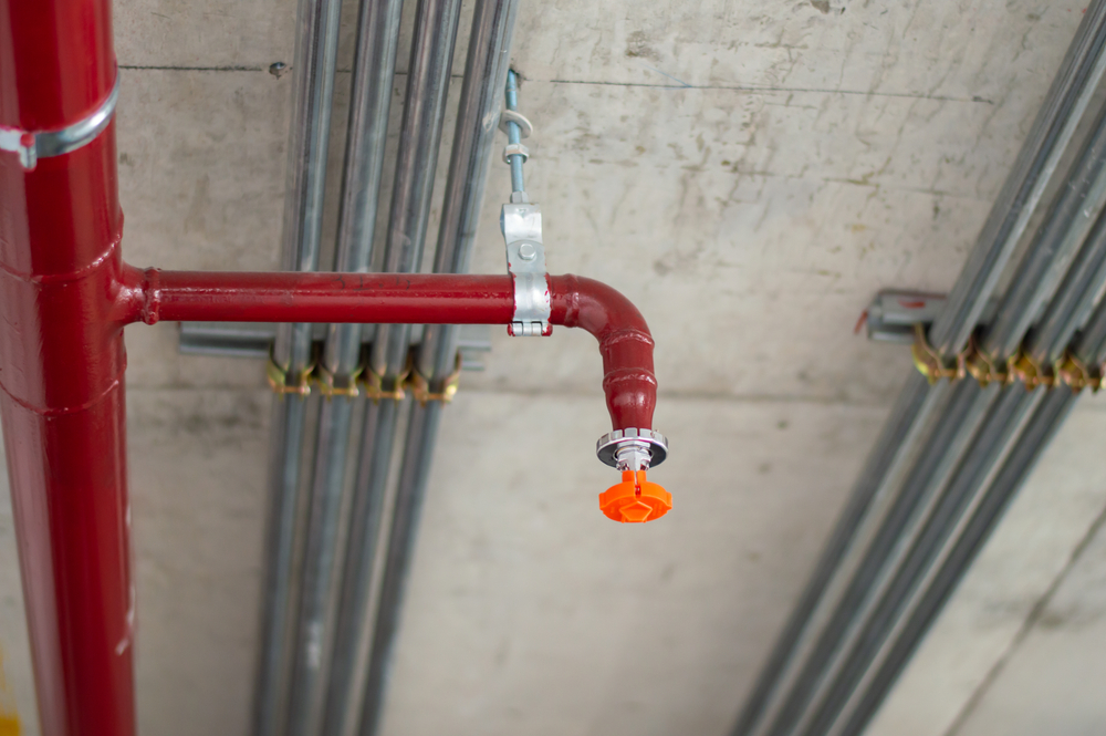 Fire,sprinkler,system,with,red,pipes,is,placed,to,hanging