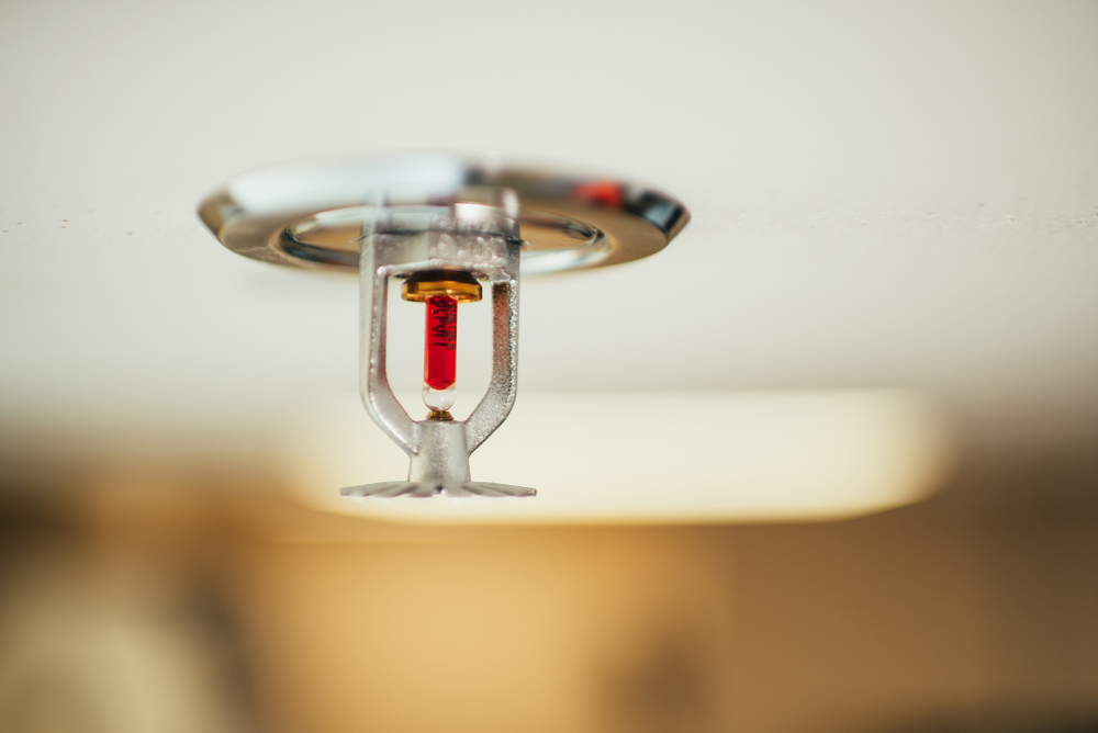 Fire,fighting,equipment,,sprinkler,on,white,ceiling,background.