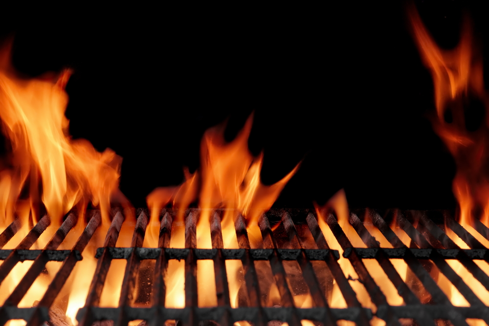 Empty,hot,charcoal,barbecue,grill,with,bright,flame,on,the